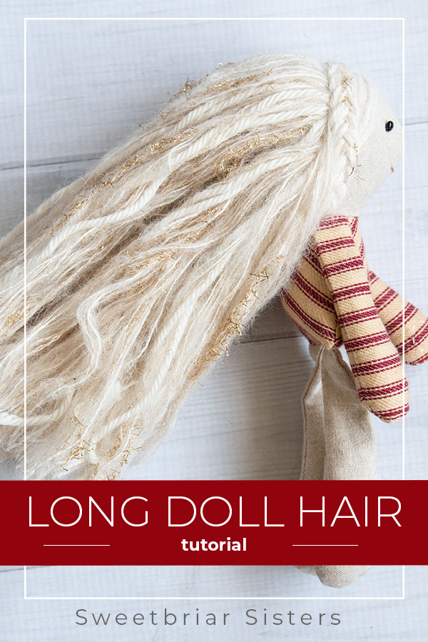 small elf doll with long blonde yarn hair