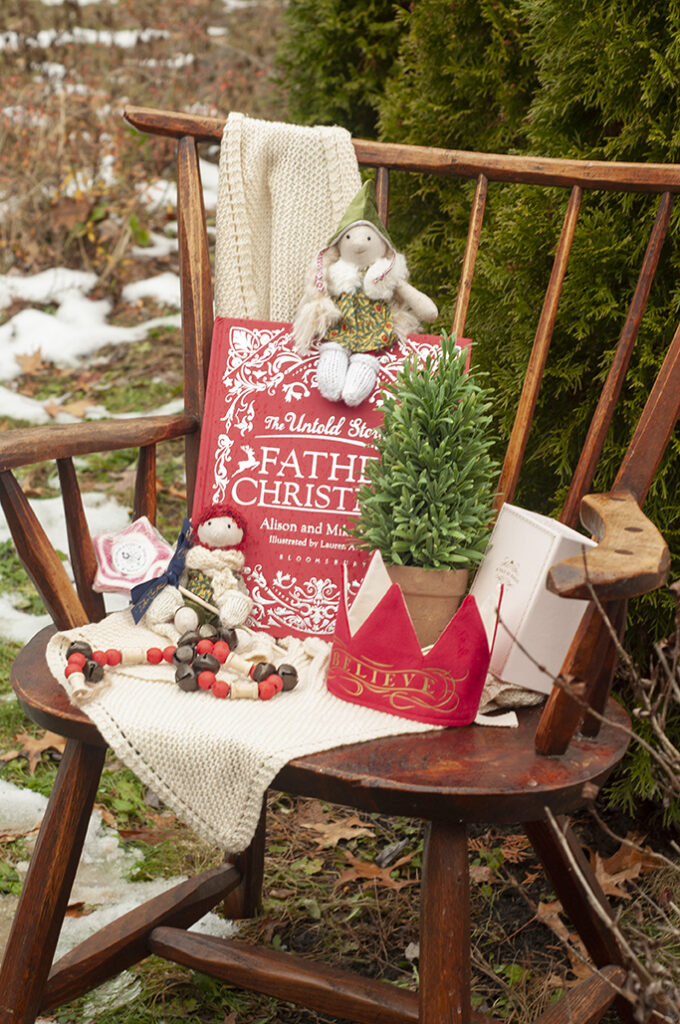 christmas elves with Father Christmas books and a Christmas crown