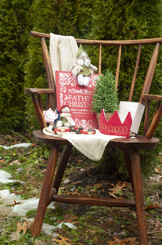 christmas elves with Father Christmas books and a Christmas crown