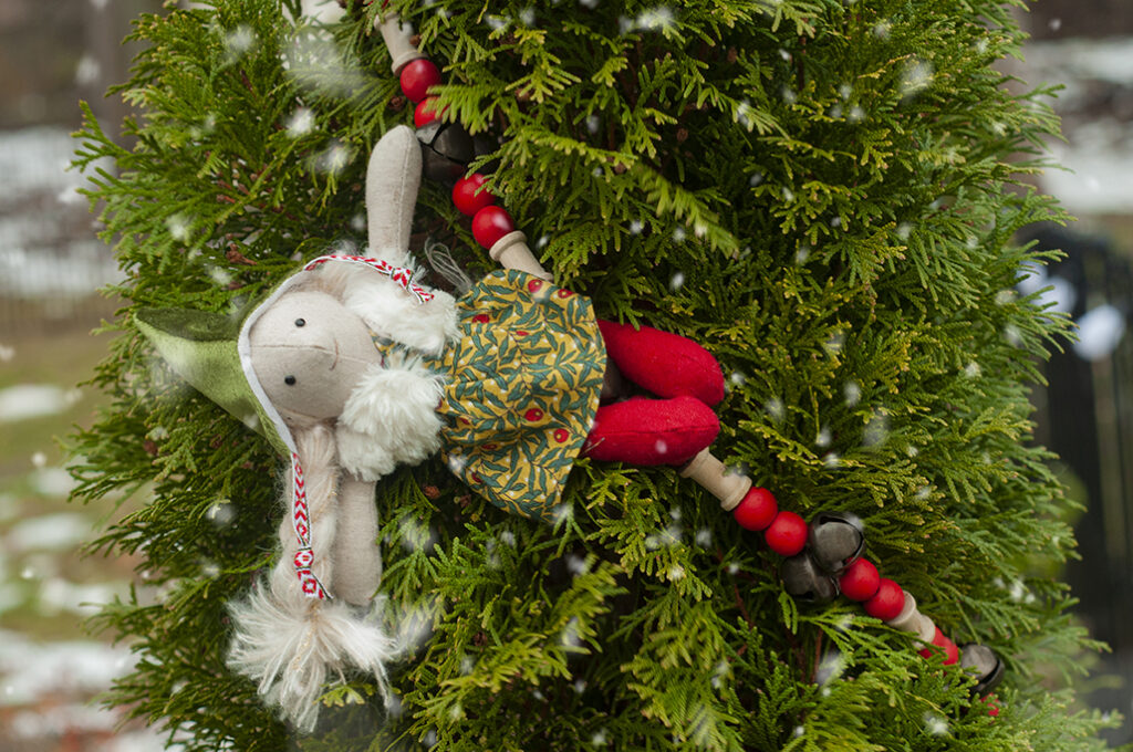 Chrsitmas elf hanging from garland