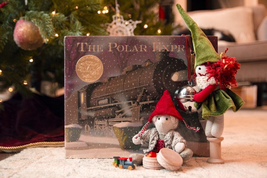 Chrsitmas elves with silver bell and Polar Express book