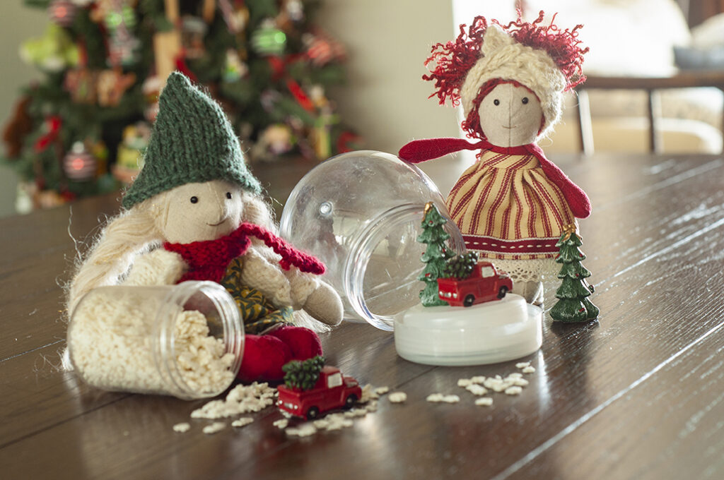 christmas elf with snow globe supplies