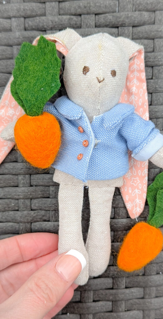 Miniature rabbit doll with a tiny carrot